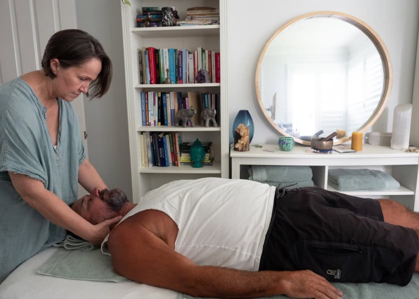 Showing Bowen therapy for headache relief with focus on cranial support