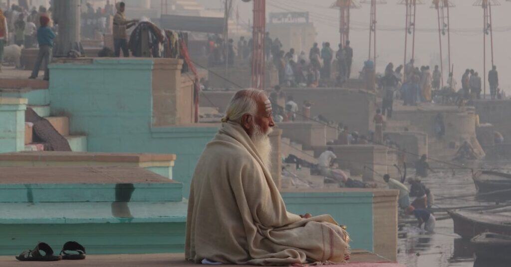 A serene scene of meditation by the Ganges River in Varanasi, highlighting spiritual tranquility.